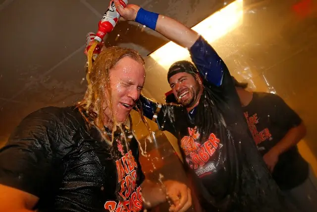 Catcher Kevin Plawecki douses Noah Syndergaard as the METS CELEBRATE CLINCHING A PLAYOFF SPOT IN PHILADELPHIA.